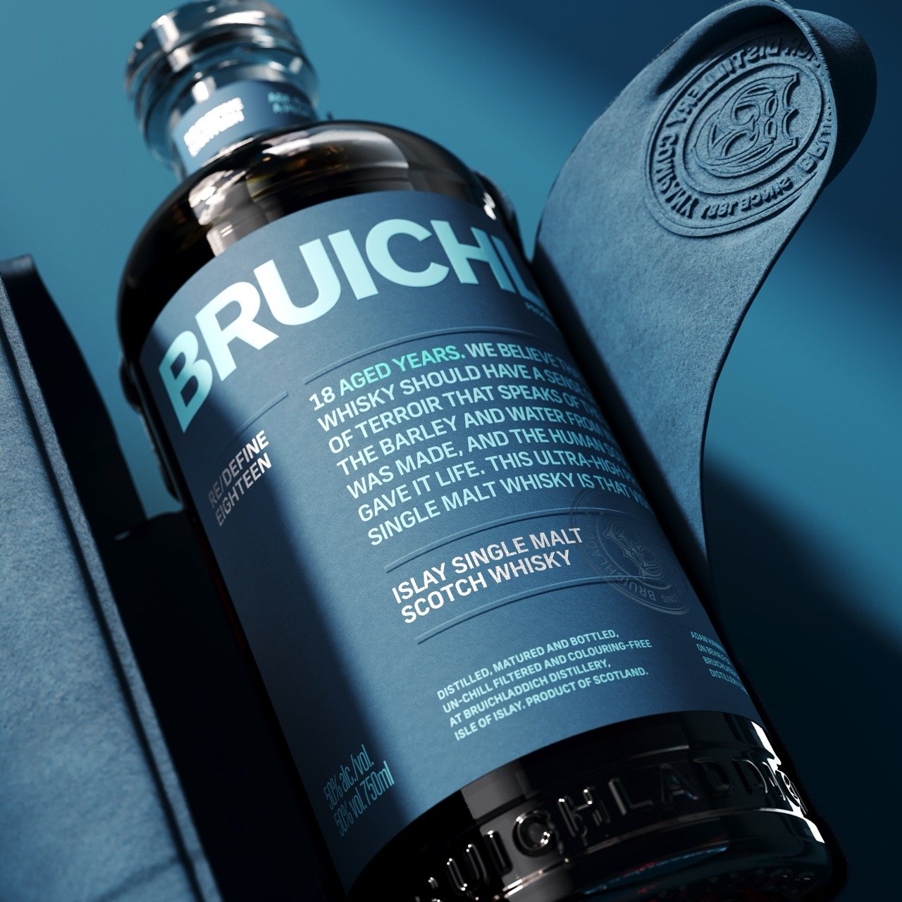 Bruichladdich Islay single malt whisky bottle presented against blue fabric