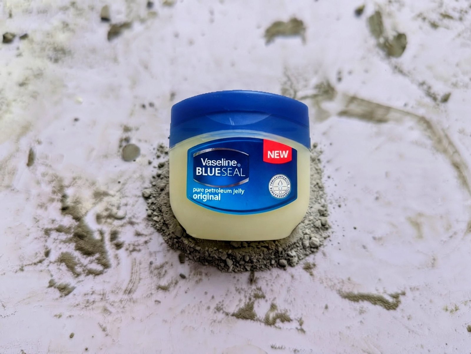 Jar of petroleum jelly used as a mold-release coating
