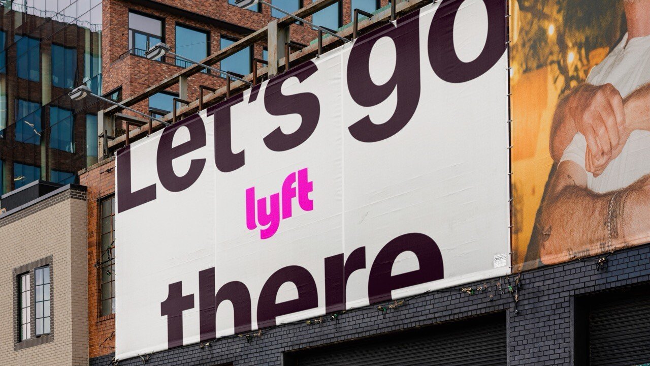 Large Lyft Let's Go There billboard on a brick building