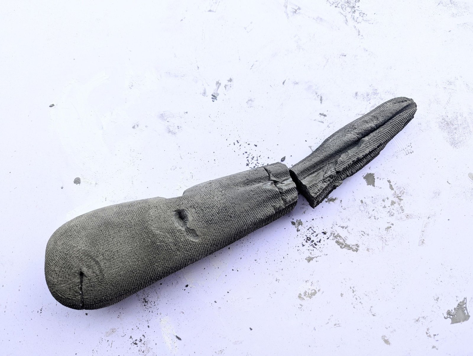 Cured sock-molded cement stem after the excess tip has been removed