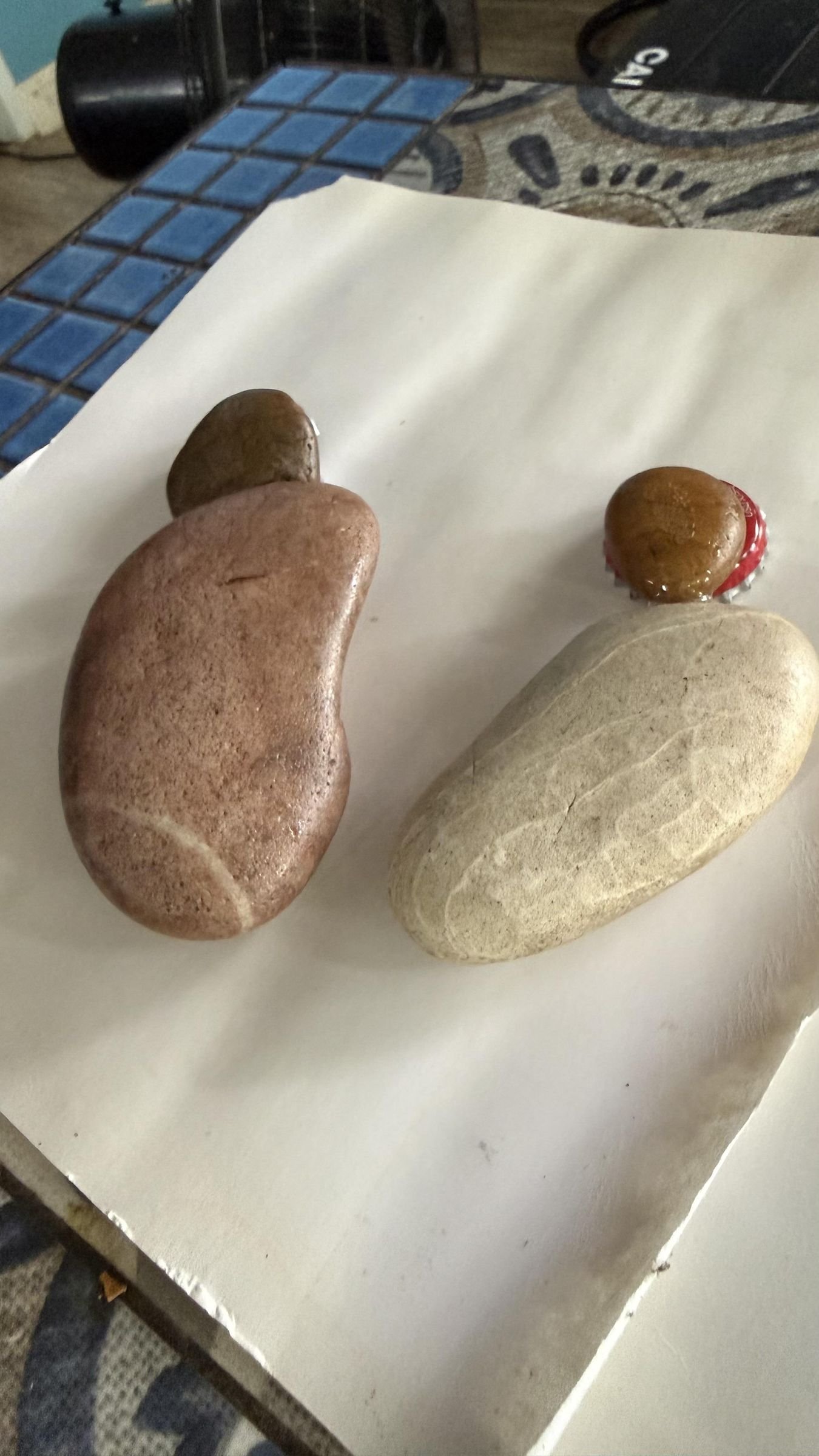 Two cactus-shaped stone assemblies resting while their epoxy joints cure
