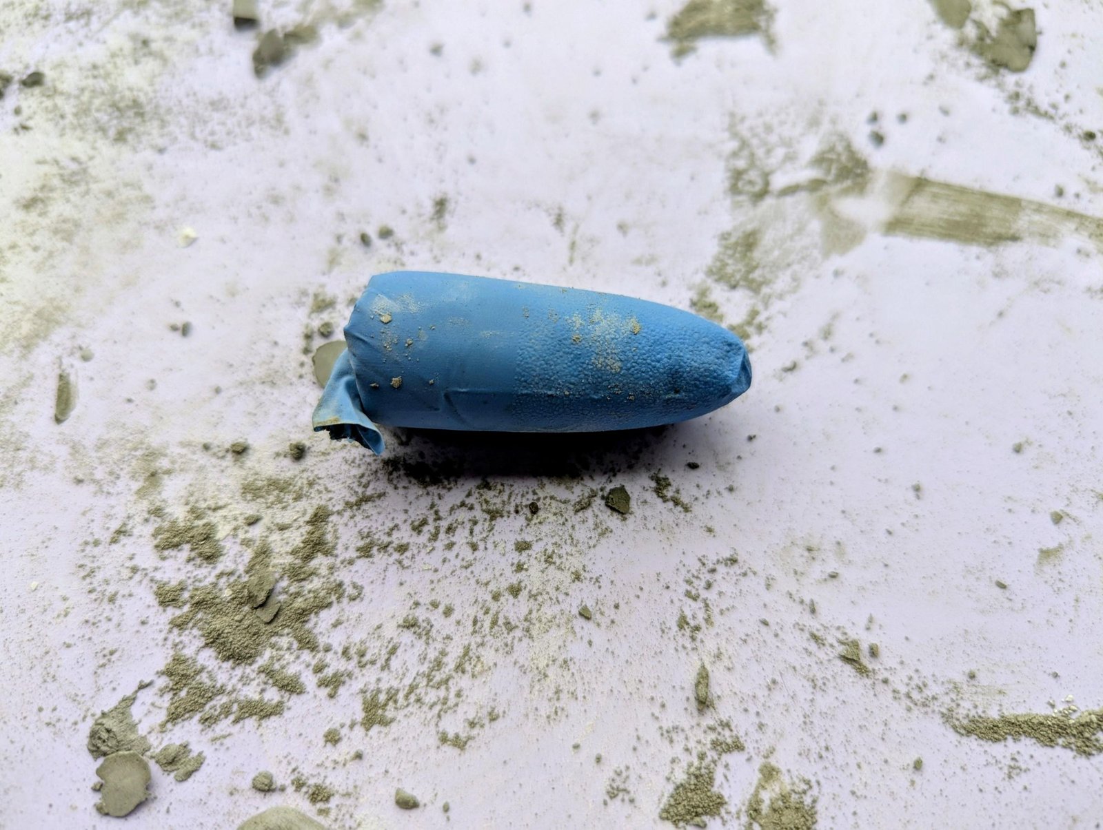 Rubber-glove finger mold filled with cement for a miniature stem