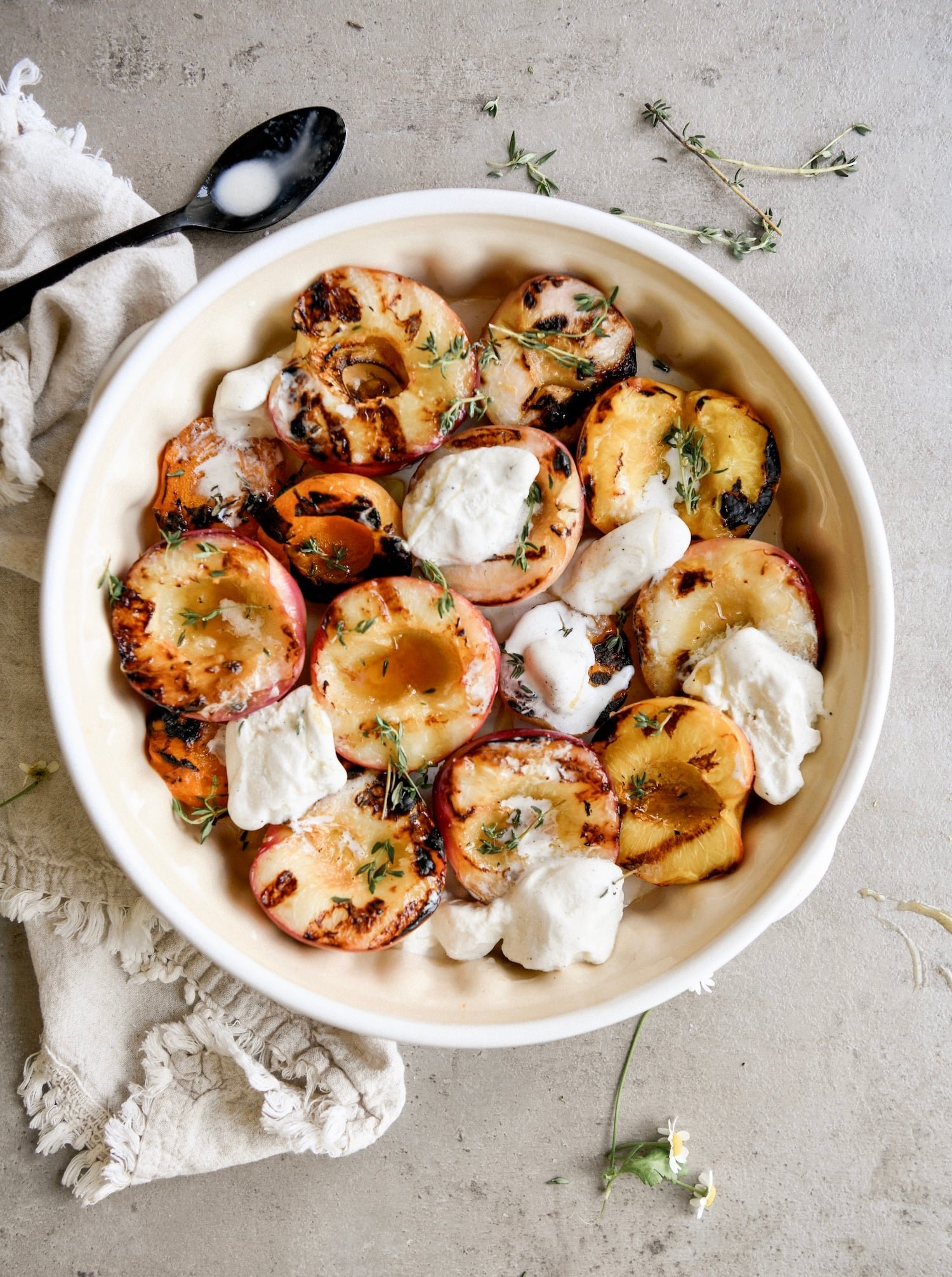 Grilled peaches with vanilla ice cream and fresh thyme