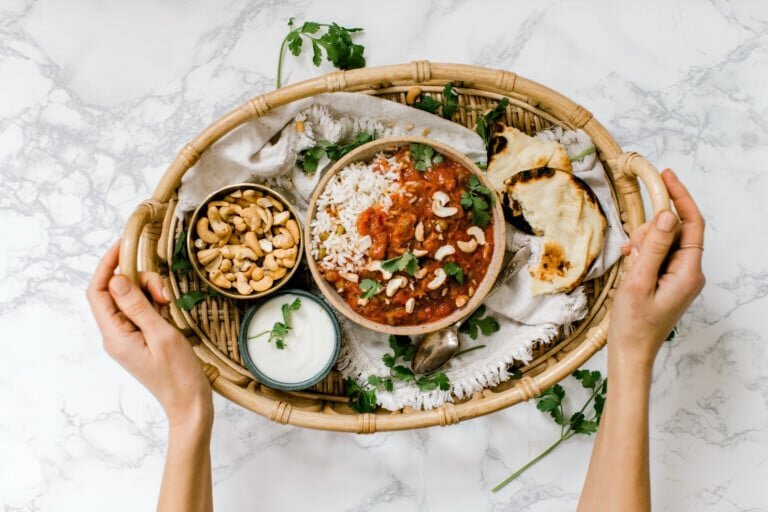 Tray of slow-cooker chicken tikka masala with flatbread
